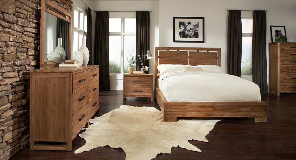 This is an example of a large country guest bedroom in Other with white walls, dark hardwood floors and brown floor.