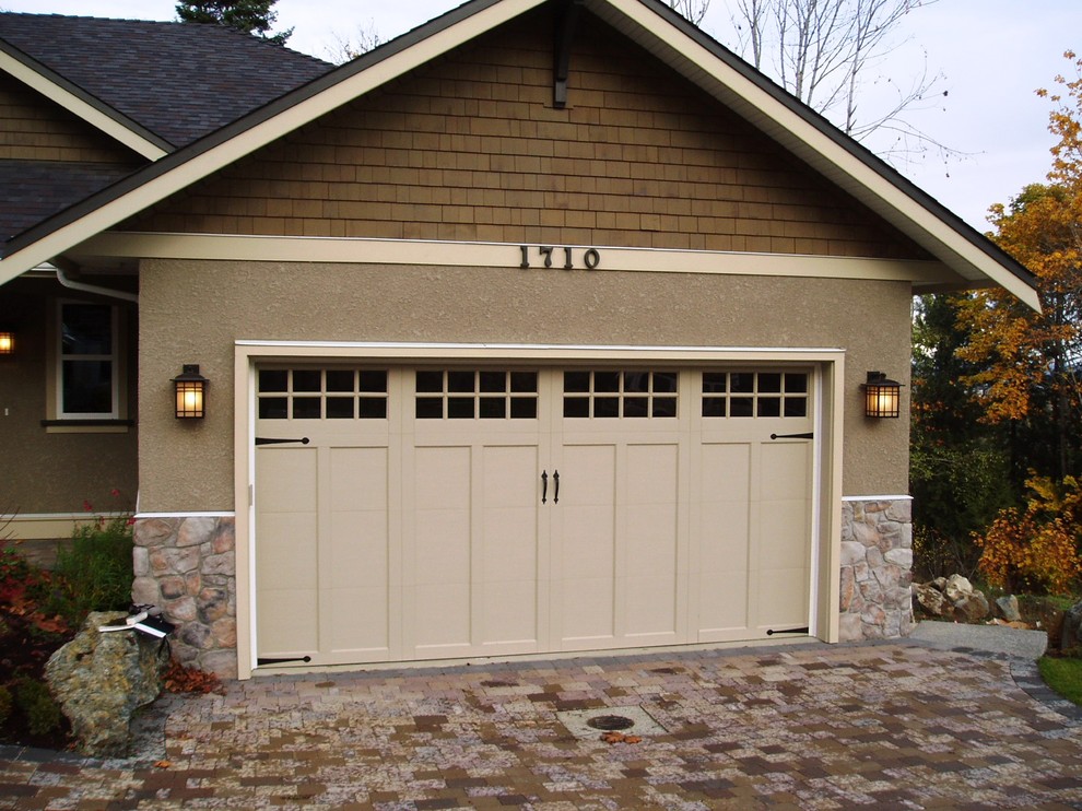 Inspiration for a traditional two-car garage in Vancouver.