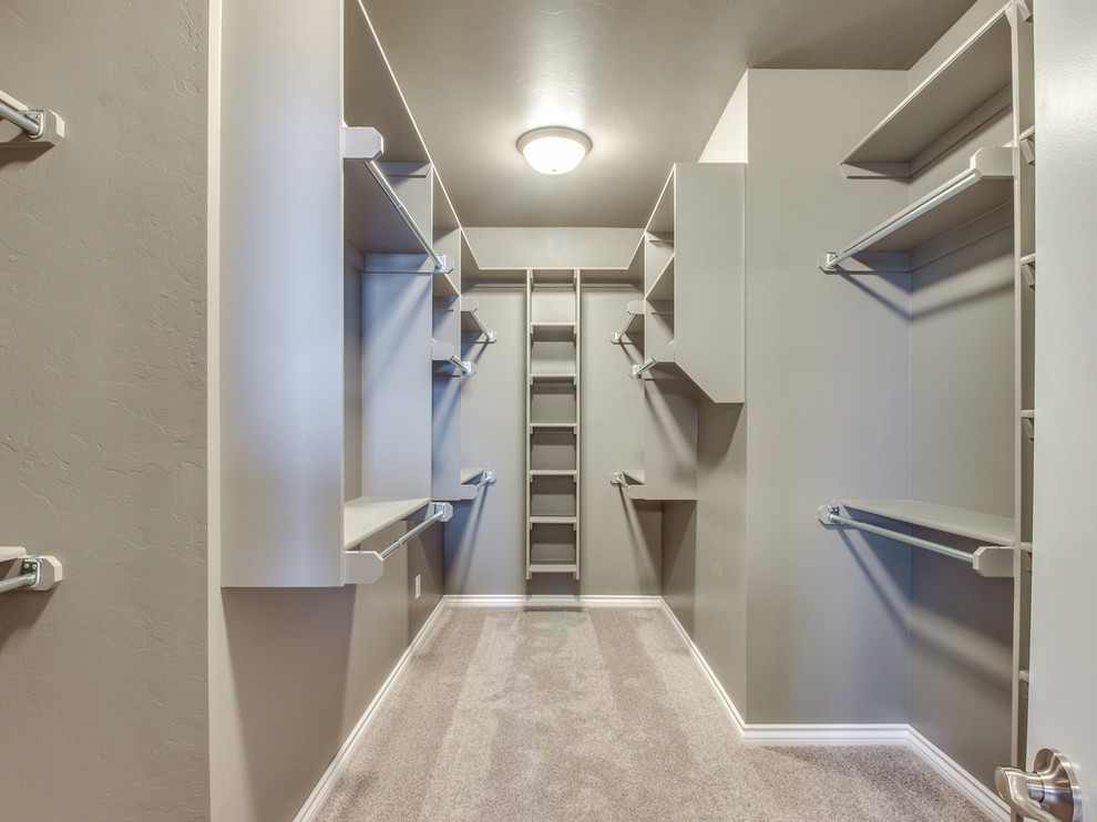 This is an example of a transitional storage and wardrobe in Oklahoma City.