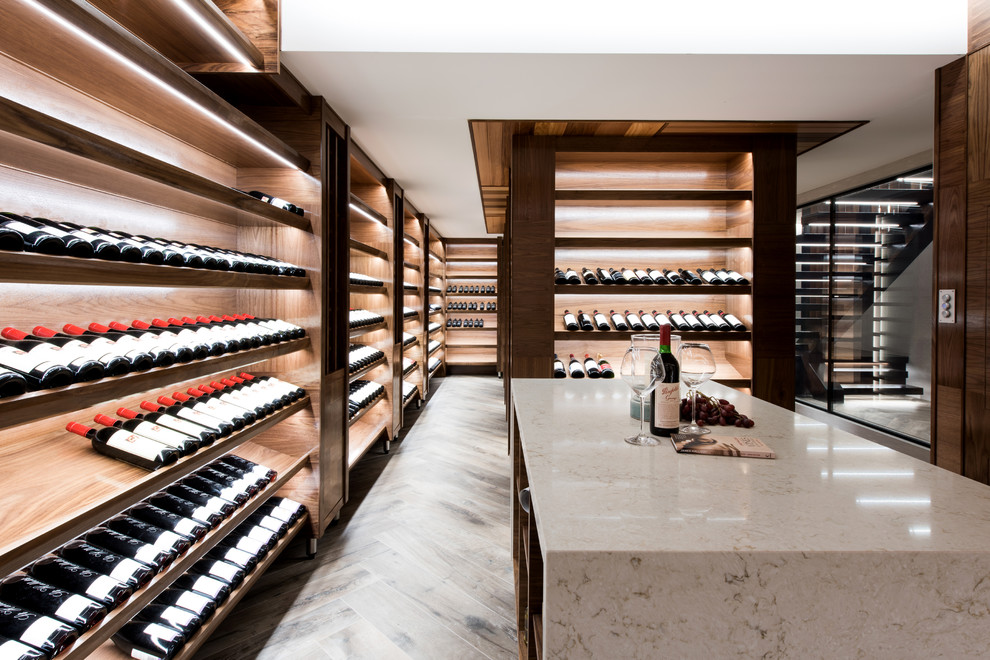 Photo of a contemporary wine cellar in Sunshine Coast with display racks and brown floor.