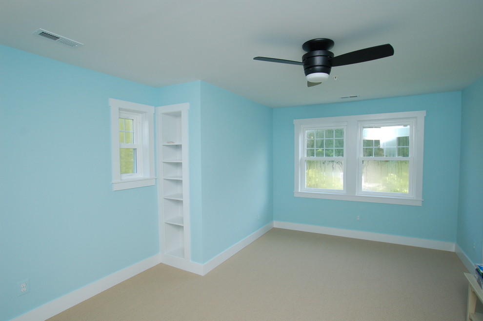 Design ideas for a mid-sized beach style bedroom in DC Metro with blue walls and carpet.