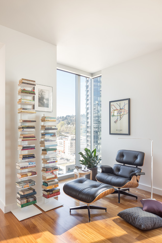 Trendy medium tone wood floor living room photo in Portland with white walls