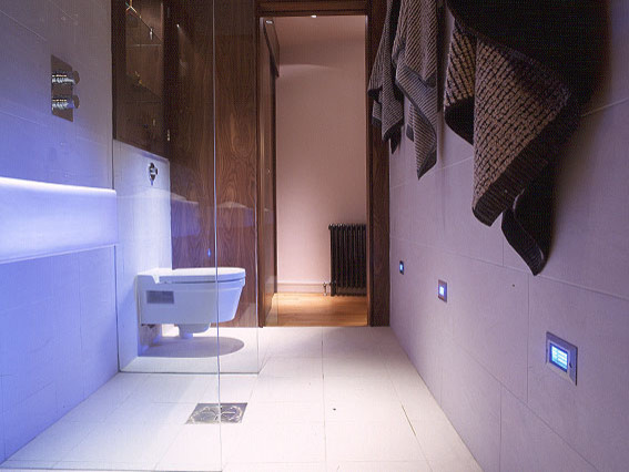 Inspiration for a small contemporary master bathroom in Edinburgh with a wall-mount sink, an open shower, a wall-mount toilet, white tile, porcelain tile, white walls and porcelain floors.