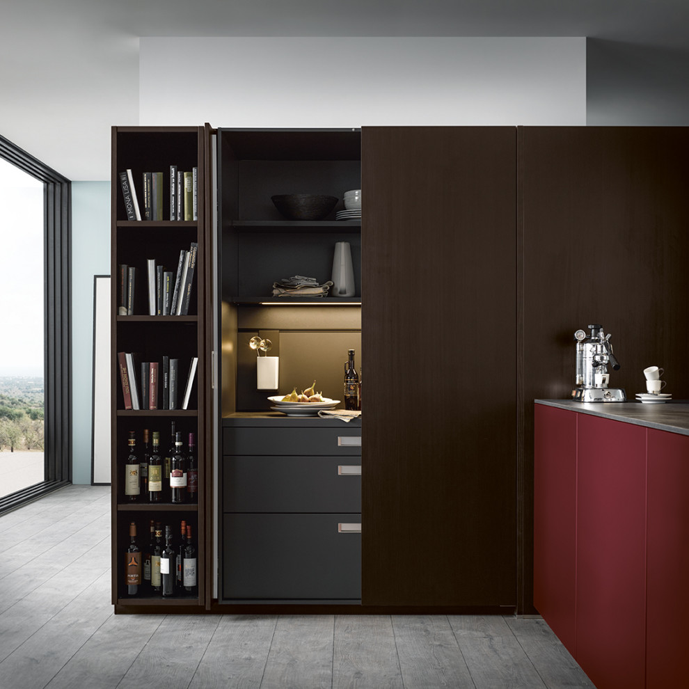 Design ideas for an expansive contemporary l-shaped eat-in kitchen in Nuremberg with flat-panel cabinets, red cabinets, glass benchtops and a peninsula.