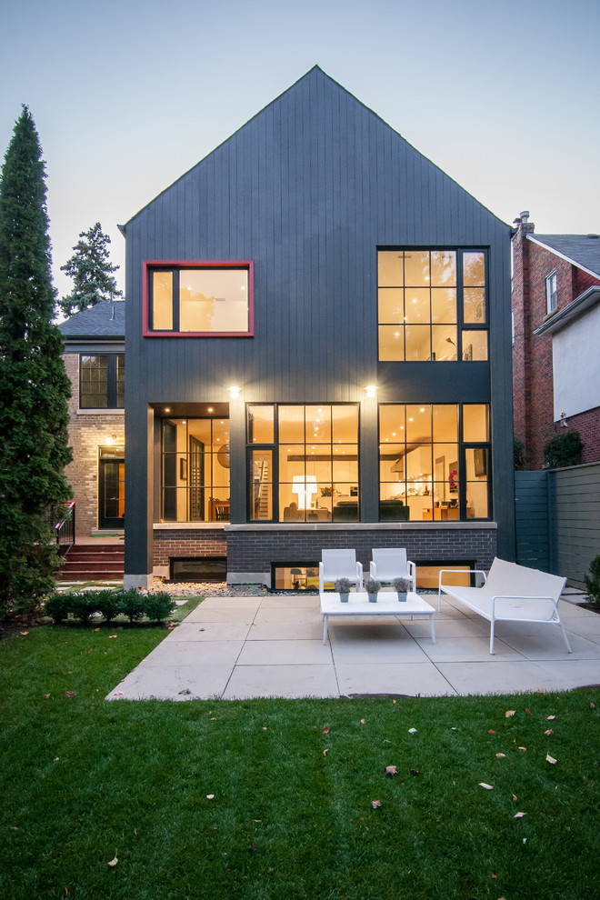 This is an example of a contemporary two-storey exterior in Toronto with a gable roof.