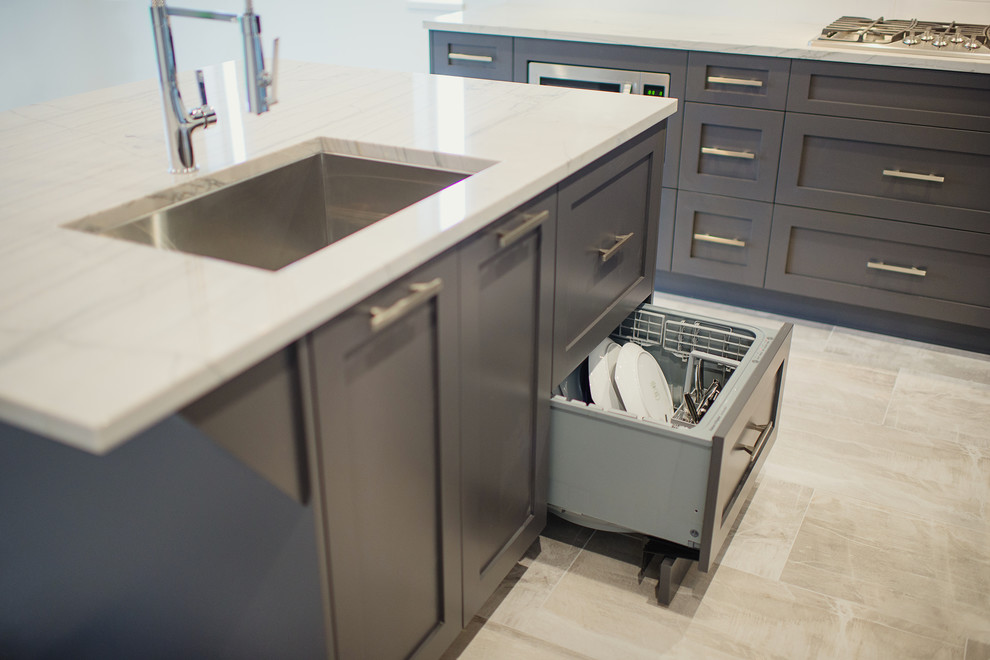 Inspiration for a mid-sized transitional l-shaped eat-in kitchen remodel in Vancouver with a single-bowl sink, shaker cabinets, gray cabinets, marble countertops, white backsplash, stainless steel appliances and an island