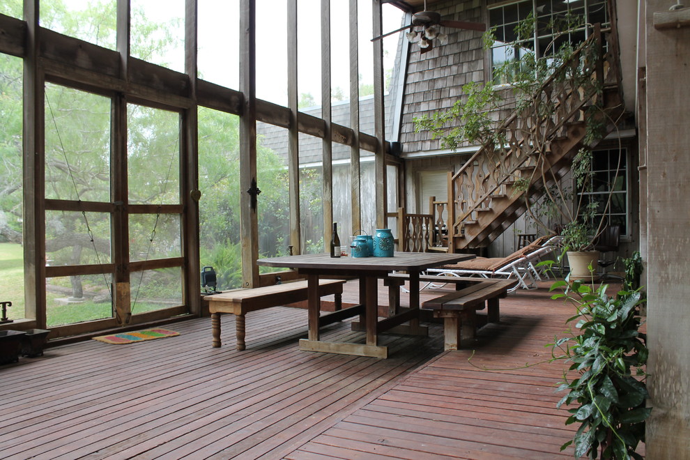 This is an example of a country deck in Austin with a container garden.