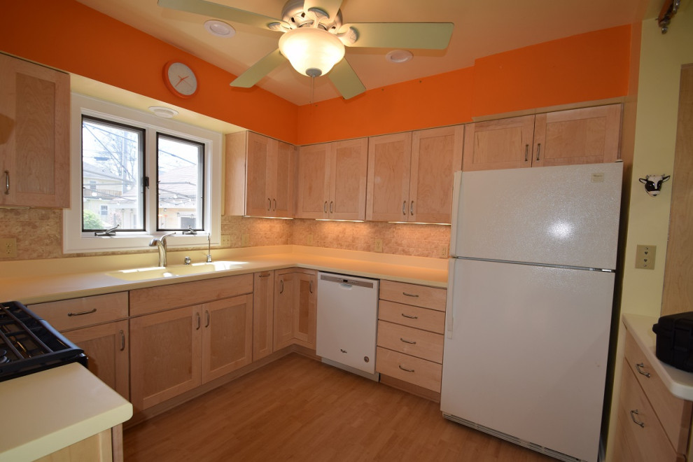Inspiration for a mid-sized transitional u-shaped light wood floor kitchen remodel with an integrated sink, shaker cabinets, light wood cabinets, multicolored backsplash, stone tile backsplash, a peninsula and white countertops
