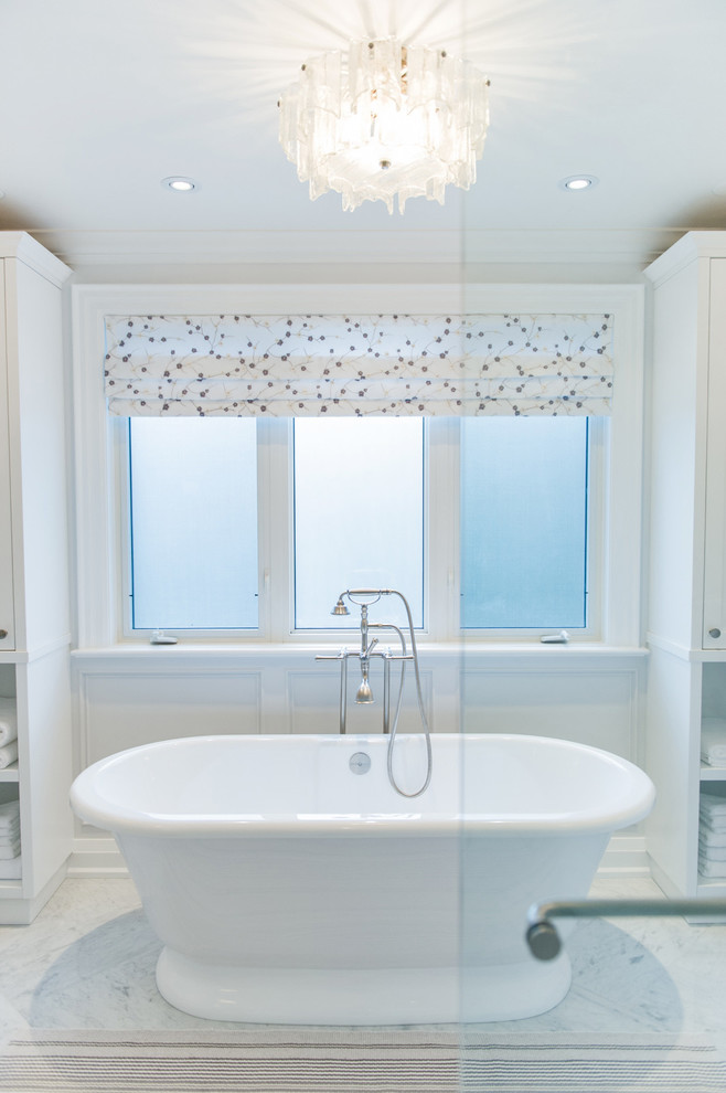 Inspiration for a large contemporary master bathroom in Toronto with furniture-like cabinets, white cabinets, a freestanding tub, an alcove shower, white walls, marble floors, an undermount sink, marble benchtops, multi-coloured floor, a hinged shower door and multi-coloured benchtops.