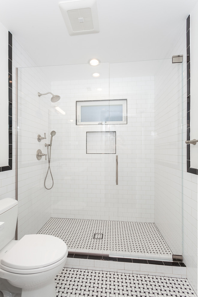 Design ideas for a mid-sized contemporary 3/4 bathroom in Los Angeles with beaded inset cabinets, white cabinets, an alcove shower, a one-piece toilet, white tile, subway tile, white walls, ceramic floors, a drop-in sink, granite benchtops, white floor, a sliding shower screen and white benchtops.