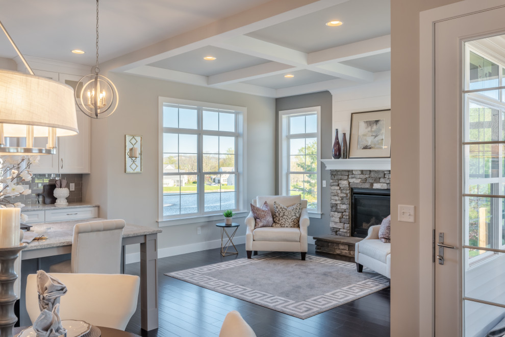 Inspiration for an expansive arts and crafts formal open concept living room in Other with grey walls, dark hardwood floors, a standard fireplace, a stone fireplace surround, brown floor and coffered.