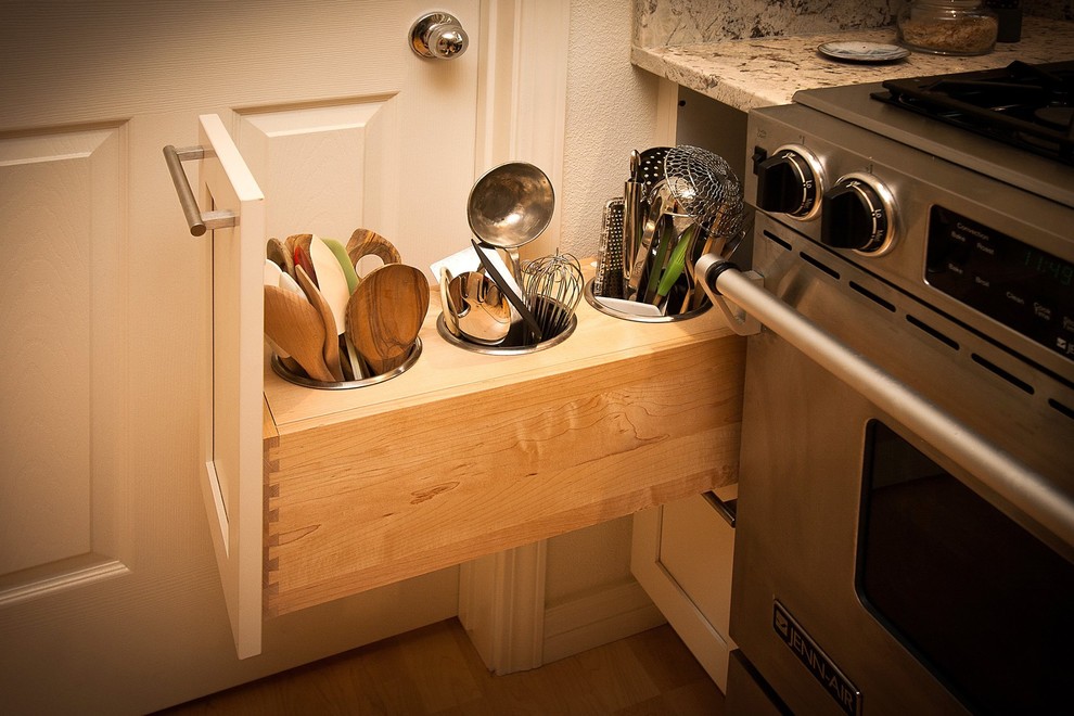 Example of a mid-sized transitional l-shaped light wood floor open concept kitchen design in Boise with an undermount sink, shaker cabinets, white cabinets, granite countertops, stainless steel appliances and an island