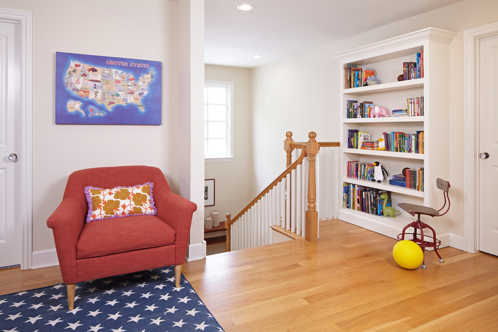 Mid-sized trendy gender-neutral medium tone wood floor playroom photo in Los Angeles with beige walls