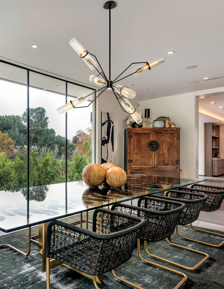 Photo of a contemporary separate dining room in Los Angeles with beige walls.