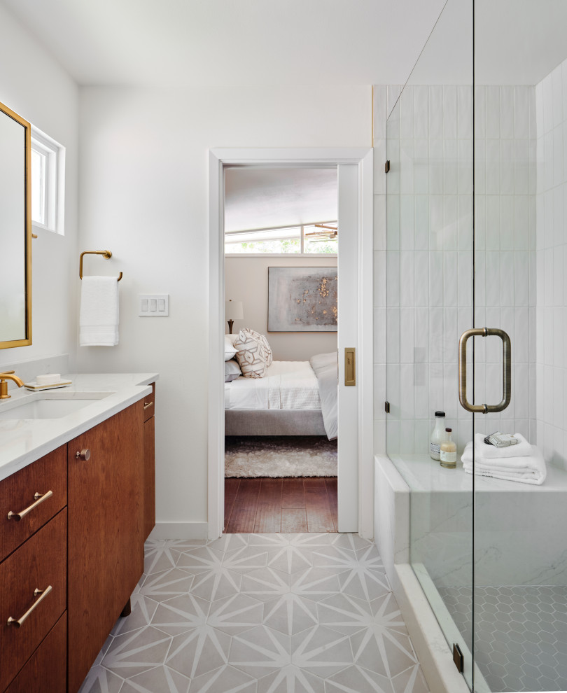 Inspiration for a small midcentury master bathroom in Austin with furniture-like cabinets, medium wood cabinets, an open shower, a one-piece toilet, white tile, ceramic tile, white walls, ceramic floors, an undermount sink, engineered quartz benchtops, grey floor, a hinged shower door, white benchtops, a shower seat, a double vanity and a freestanding vanity.