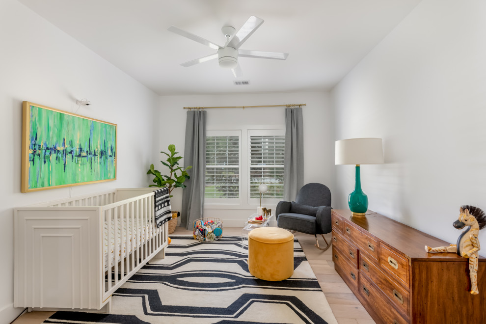 Inspiration for a large transitional nursery for boys in Charleston with white walls, light hardwood floors and beige floor.