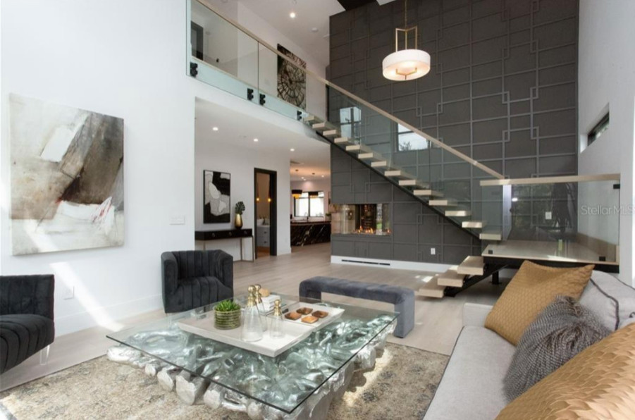 На фото: парадная, открытая гостиная комната среднего размера в стиле модернизм с белыми стенами и светлым паркетным полом без камина, телевизора