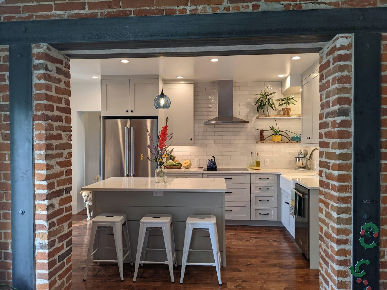 Expanded Brick Wall Opening with Remodeled Golden Kitchen