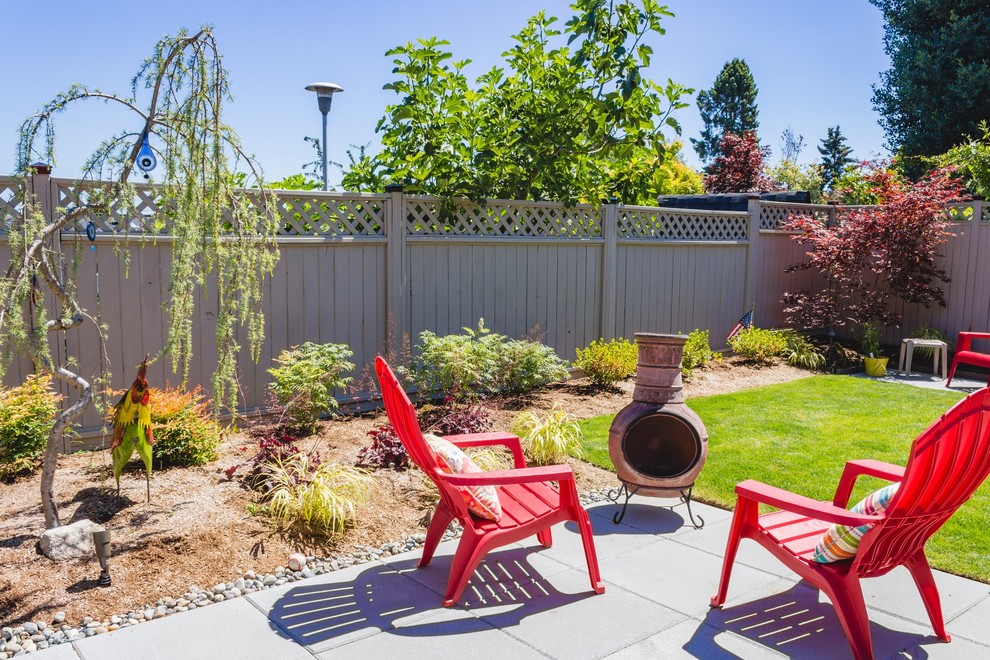 Inspiration for a mid-sized transitional backyard patio in Seattle with a vegetable garden, concrete pavers and no cover.