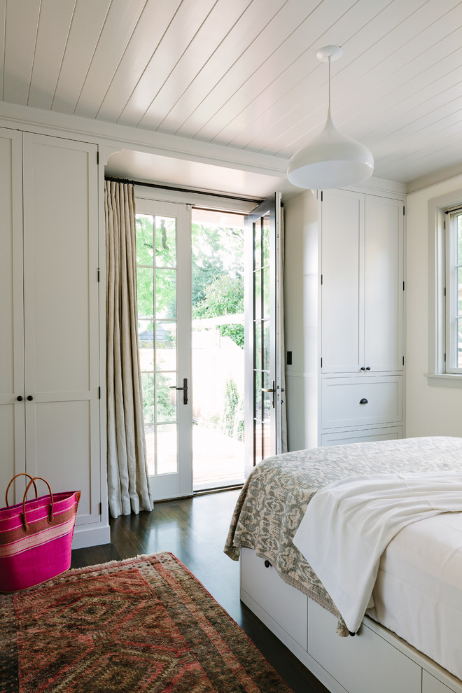 Transitional master bedroom in Portland with white walls and dark hardwood floors.