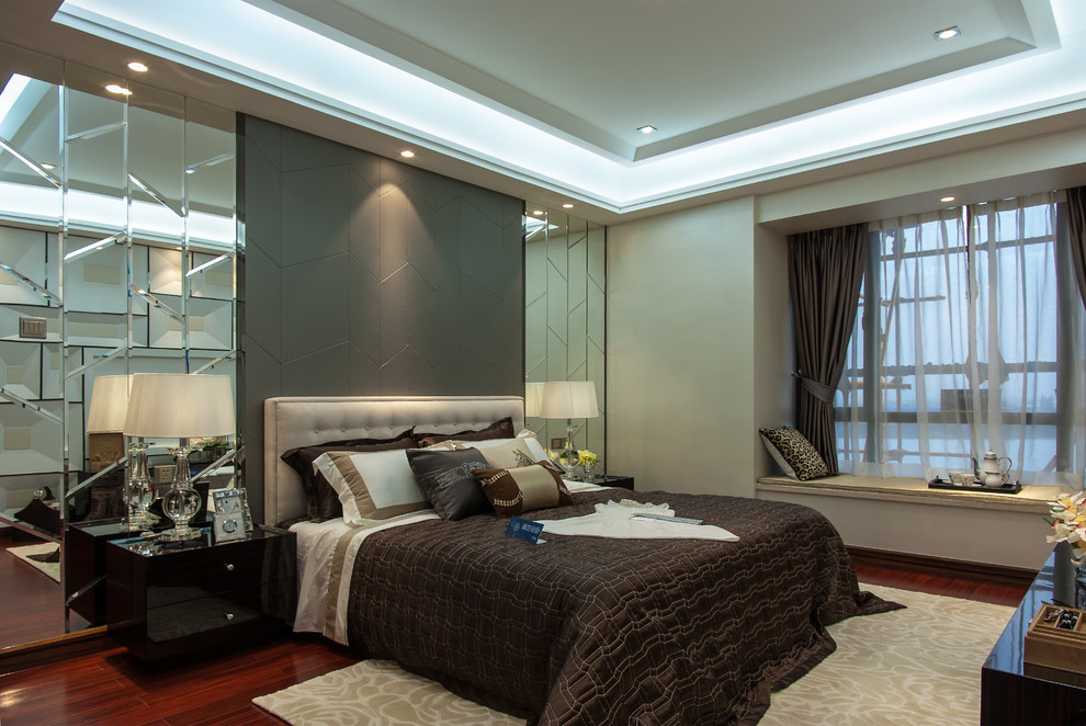 This is an example of a large contemporary master bedroom in Other with beige walls and no fireplace.