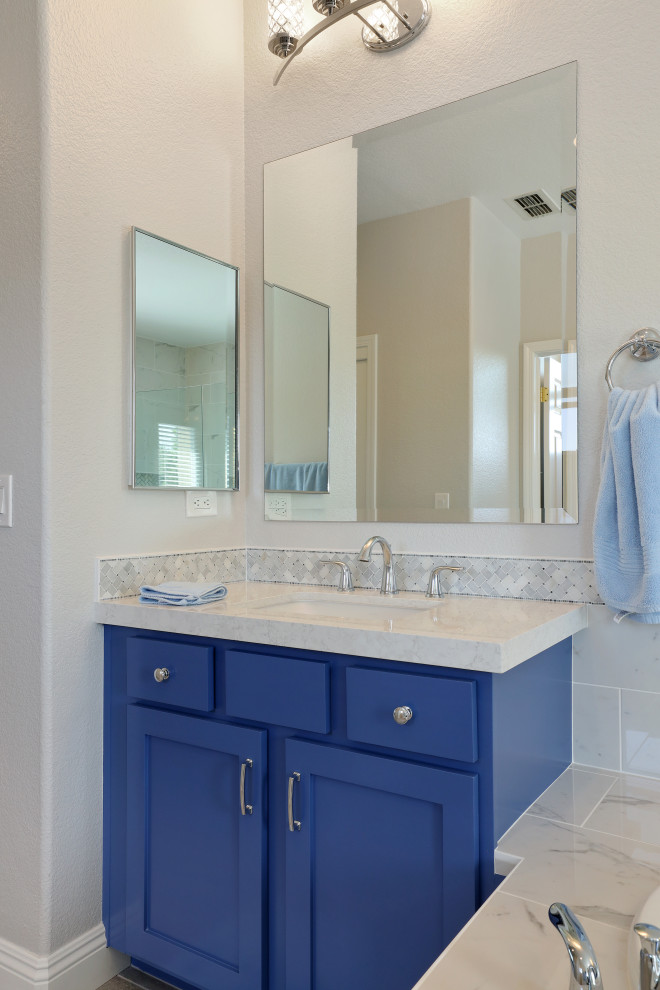 Example of a minimalist master white tile and porcelain tile porcelain tile, beige floor and double-sink bathroom design in Sacramento with blue cabinets, white walls, an undermount sink, a hinged shower door, white countertops and a built-in vanity