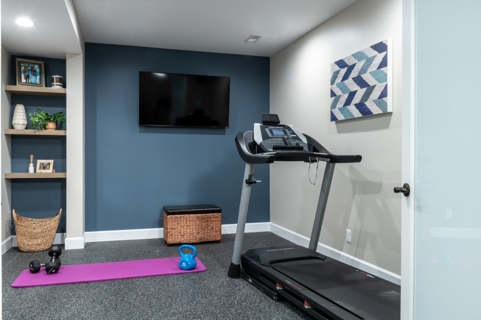 Large transitional home gym in St Louis with grey walls, vinyl floors and brown floor.