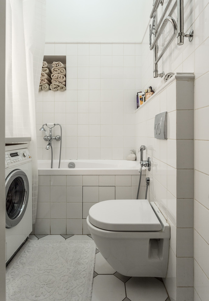 This is an example of a small contemporary bathroom in Moscow with an alcove tub and a wall-mount toilet.