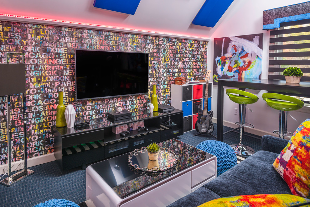 Coming of Age - a teen 'hang space' - This game room belongs to a world travelling family - making the wallpaper a natural for the former 'play room' . The colors in the wallcovering  made the rest of the color selections easy. The shaped cornice is a silver/black weave with a bright blue band. The acoustic ceiling panels continue the bright blue and black of other elemends in the room.  Photography: Reed Brown