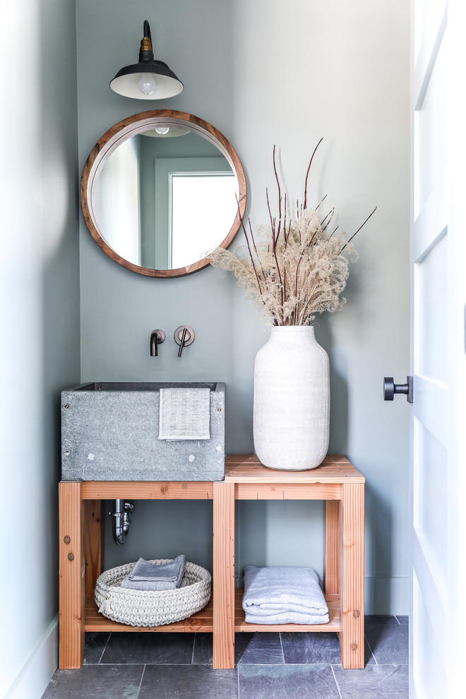 Design ideas for a small beach style powder room in Portland Maine with furniture-like cabinets, medium wood cabinets, grey walls, slate floors, soapstone benchtops, grey floor and grey benchtops.