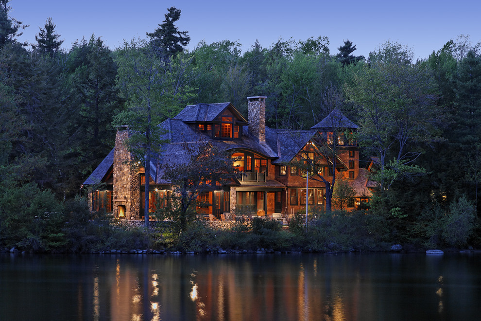 Expansive country three-storey exterior in Boston with wood siding.