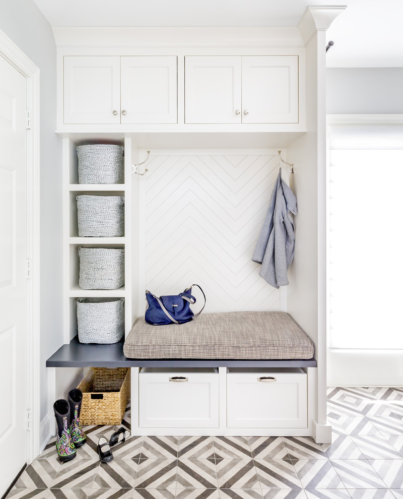 Mid-sized transitional mudroom in Chicago with grey walls, porcelain floors and multi-coloured floor.