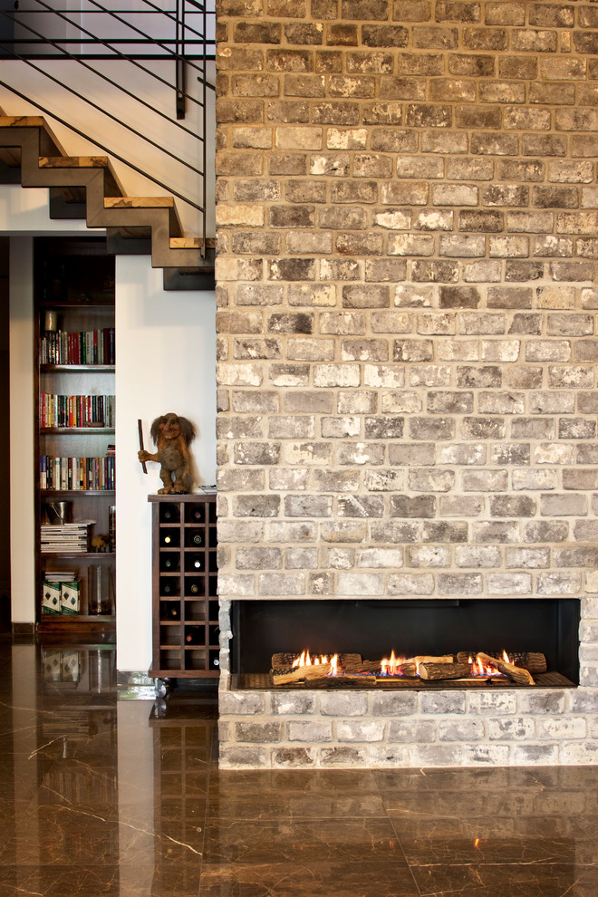 Design ideas for a contemporary family room in Los Angeles with a corner fireplace.