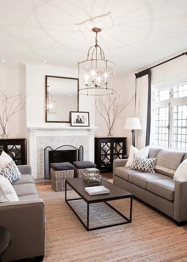 This is an example of a large contemporary formal open concept living room in Chicago with white walls, dark hardwood floors, a standard fireplace, a stone fireplace surround and brown floor.