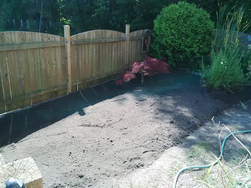 This is an example of a mid-sized full sun front yard concrete paver landscaping.