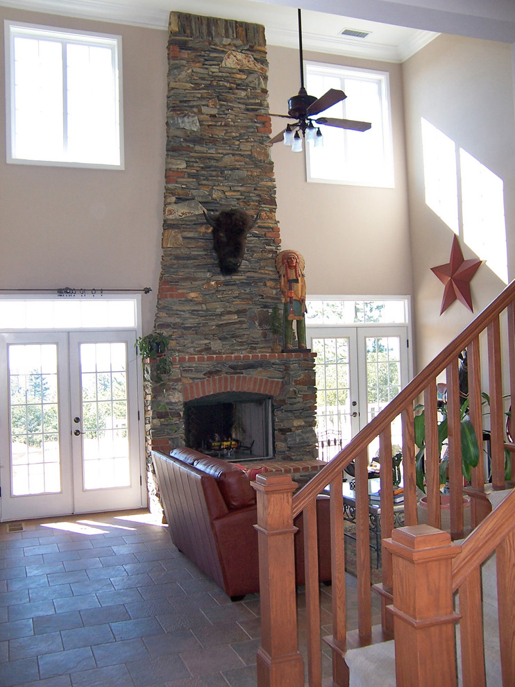 Mid-sized country open concept living room in Other with beige walls, ceramic floors, a standard fireplace and a stone fireplace surround.
