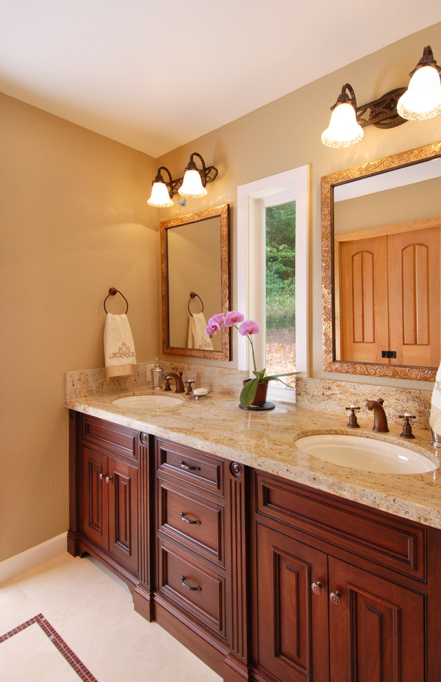 Mid-sized traditional master bathroom in San Francisco with an undermount sink, dark wood cabinets, granite benchtops, an open shower, beige tile, stone tile, raised-panel cabinets and beige benchtops.