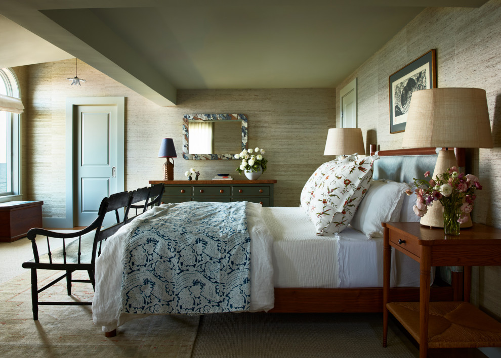 Example of a beach style carpeted, beige floor and wallpaper bedroom design in Boston with beige walls