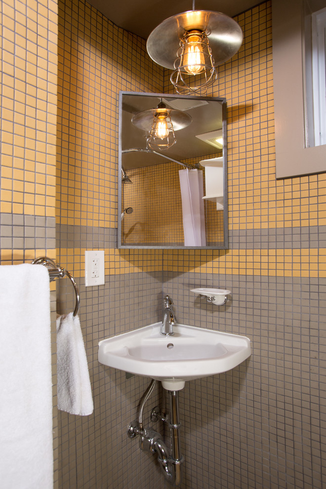 Small midcentury 3/4 bathroom in DC Metro with a wall-mount sink, a curbless shower, a two-piece toilet, multi-coloured tile, mosaic tile, multi-coloured walls and mosaic tile floors.