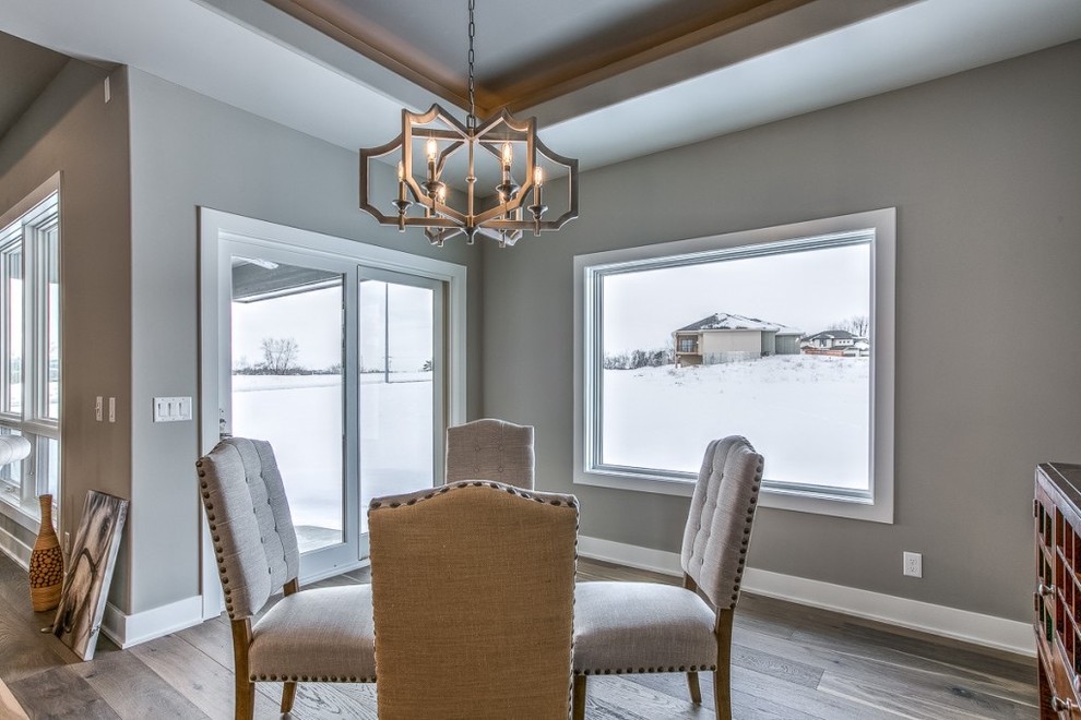 Example of a transitional dining room design in Omaha