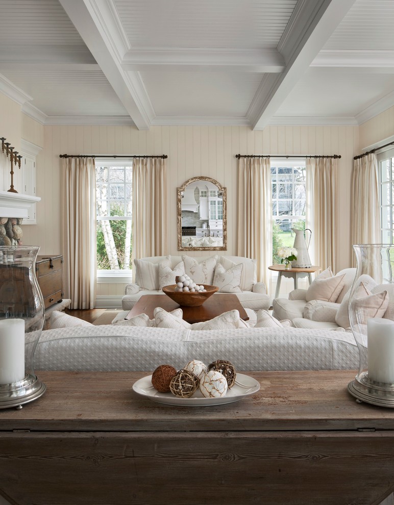 Living room - coastal medium tone wood floor living room idea in Other with beige walls, a standard fireplace, a stone fireplace and a concealed tv