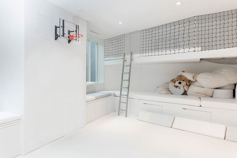 Mid-sized modern gender-neutral kids' playroom in New York with white walls and white floor for kids 4-10 years old.