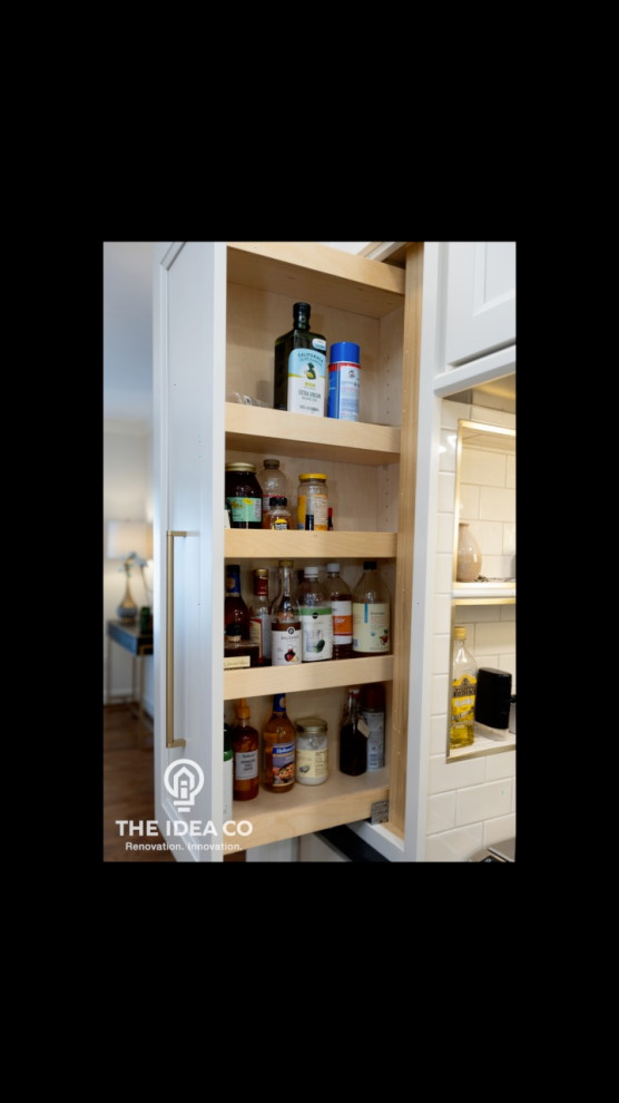 Mid-sized transitional galley light wood floor and brown floor kitchen pantry photo with a single-bowl sink, recessed-panel cabinets, white cabinets, quartzite countertops, multicolored backsplash, ceramic backsplash, stainless steel appliances, an island and white countertops