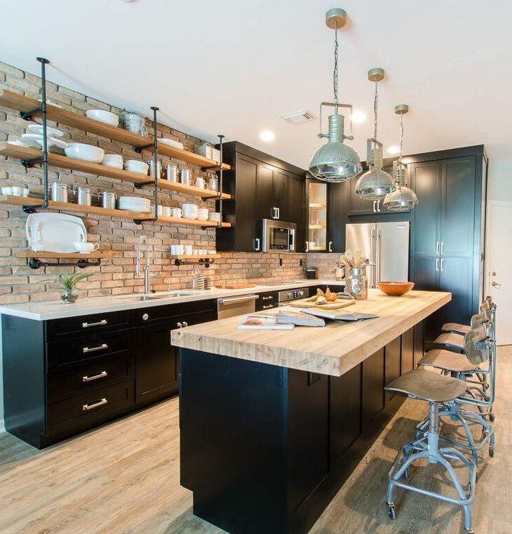 Inspiration for a small industrial kitchen in Miami with a double-bowl sink, shaker cabinets, black cabinets, quartz benchtops, stainless steel appliances, vinyl floors and with island.