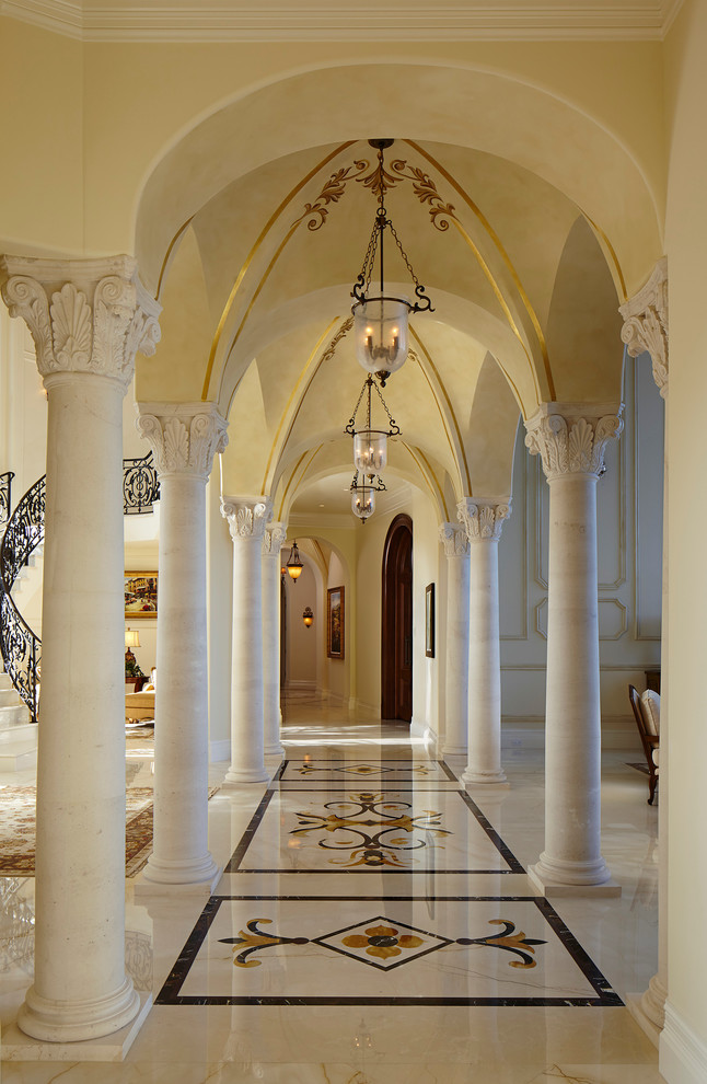 Inspiration for a mediterranean hallway in Miami with white walls.