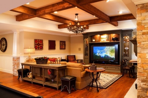 Inspiration for a mid-sized traditional open concept family room in DC Metro with a game room, beige walls, medium hardwood floors, a built-in media wall, brown floor, a standard fireplace and a stone fireplace surround.