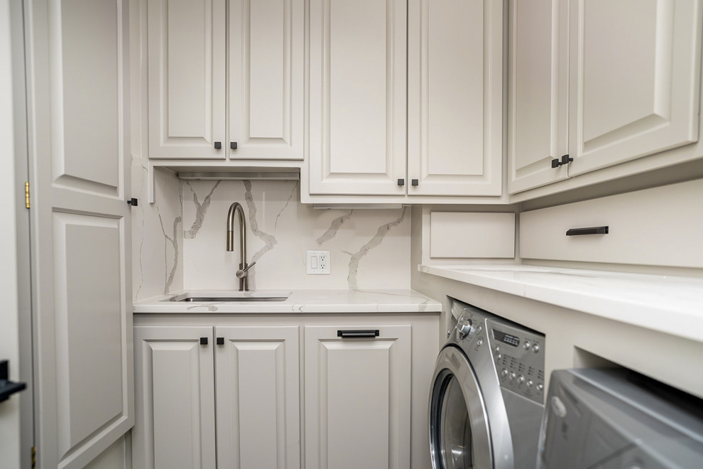 Design ideas for a transitional laundry room in Atlanta.