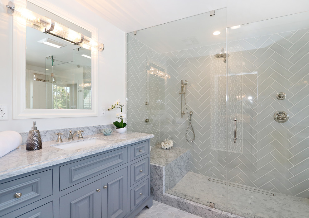Inspiration for a traditional master bathroom in Los Angeles with gray tile, marble floors, marble benchtops and grey floor.