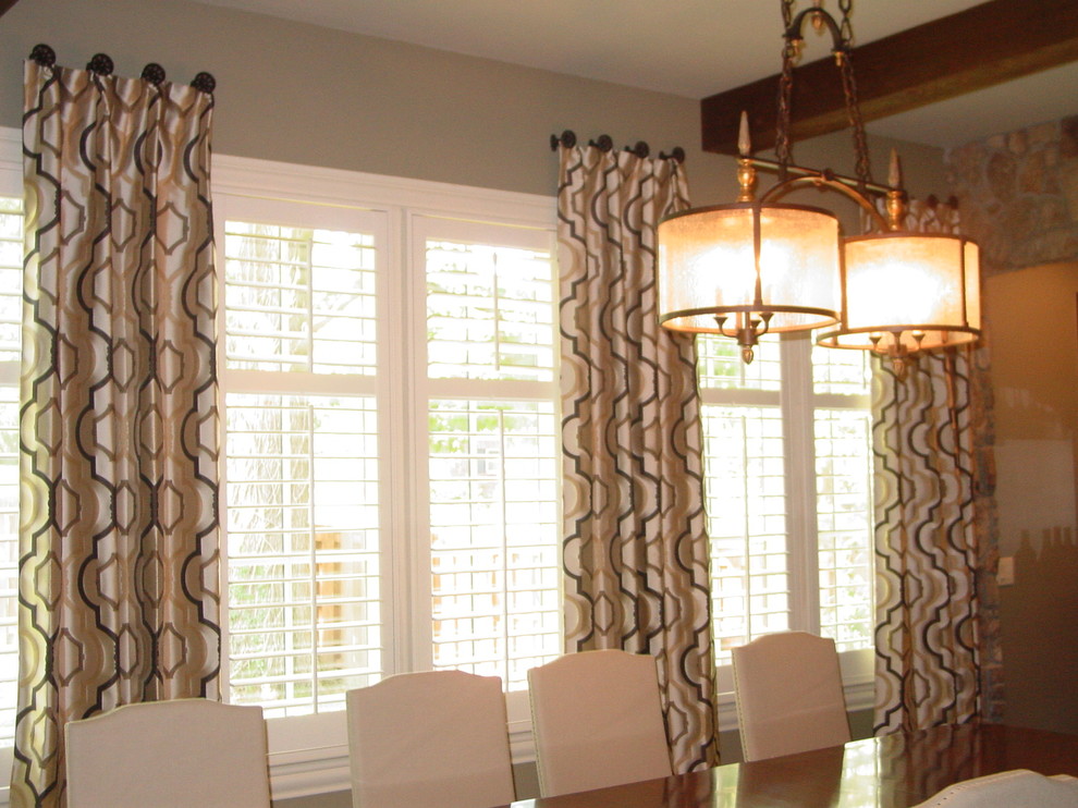 Photo of a mid-sized transitional separate dining room in Nashville with grey walls and dark hardwood floors.