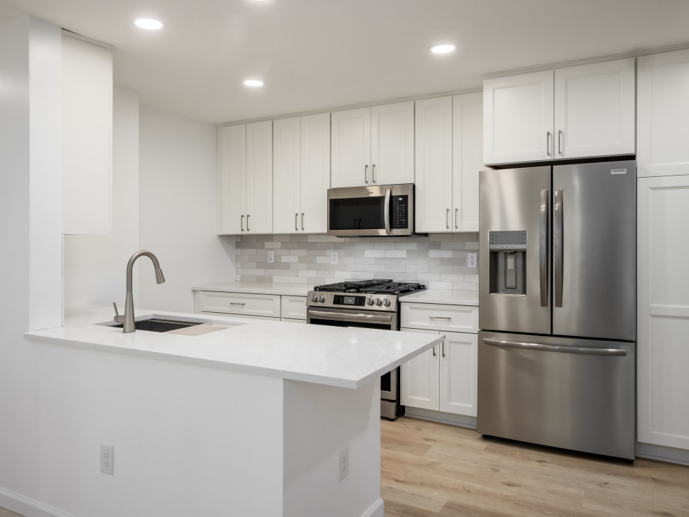 Inspiration for a small transitional galley eat-in kitchen remodel in Columbus with shaker cabinets, white cabinets, quartz countertops and white countertops